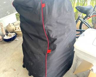 large, artificial Christmas tree in storage bag with wheels
