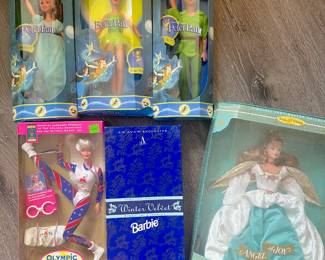 Vintage Disney figures unopened: Flying Wendy, Tinker Bell, and Peter Pan, plus collectible Barbies