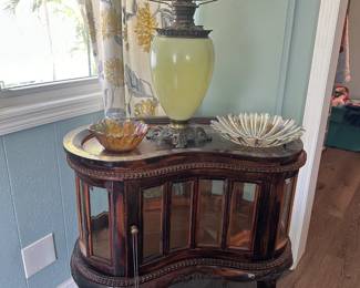 Antique lamp and glass-front antique display case, plus glassware