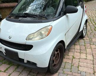 Three smart cars, various years and mileage