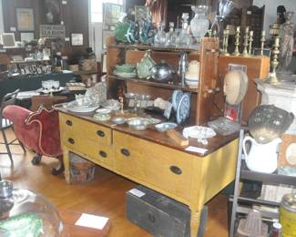 Mid 19th century three drawer work counter in old yellow with scrub pine top