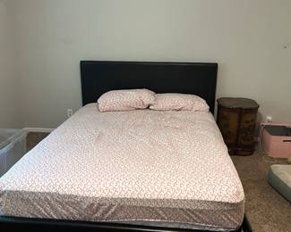 Queen bed frame and mattress.
Asian side table