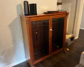 Glass front cabinet. Lights up.