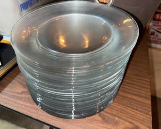Dozens of glass dinner plates