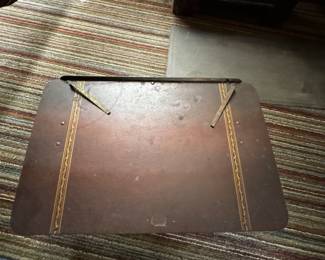 Writing table with moving paper holder