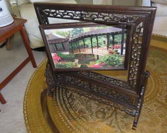 Two sided silk embroidery on carved wooden frame/stand.