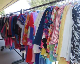 Racks and racks of clothing on the balcony.