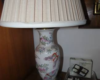 Single table lamp with butterfly decor.