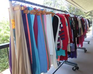 Racks and racks of clothing on the balcony.
