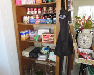 Groceries, vases and recipe boxes full.