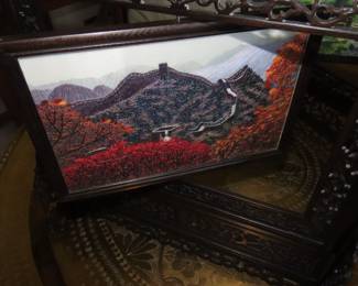 Two sided silk embroidery on carved wooden frame/stand.