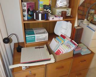Three filing cabinets, teak bookcase, frames and stationary.