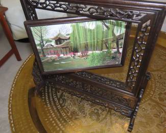 Two sided silk embroidery on carved wooden frame/stand.