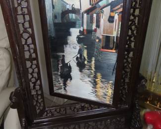 Two sided silk embroidery on carved wooden frame/stand.