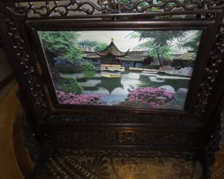 Two sided silk embroidery on carved wooden frame/stand.