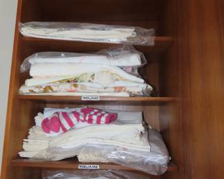 Shelves of table linens.