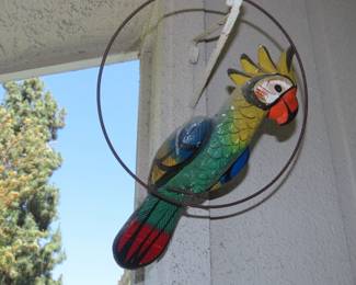 Paper mache parrots.