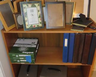 Frames, paper, teak bookcases.