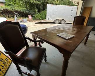 Hooker leather chairs (8 available) and antique dining table