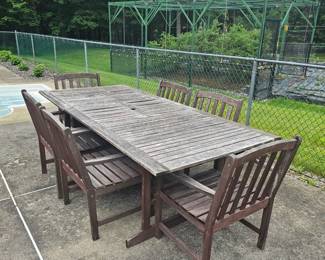 7 piece  Teak/Eucalyptus outdoor dining set, oversized chairs, Umbrella hole, the one leaf folds down (hides underneath) to create a 4 chair table