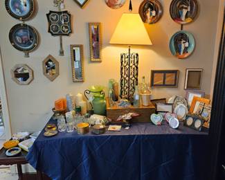 Vintage and antique plates, mirrors, candles and candle holders, vases, and picture frames.