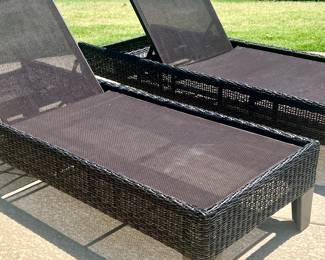 Pair of woven patio lounge chairs. 