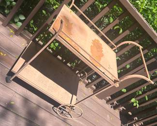 we our guest, but our service to the test with this vintage metal tea cart.
