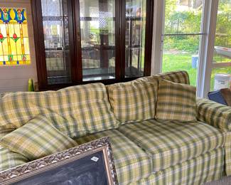Beautiful quality eight way hand-tied sofa. Has been in storage and needs a good cleaning but has never been in a home.  Gorgeous lighted China cabinet. 