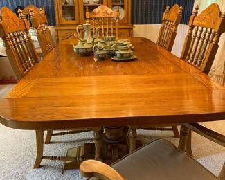 Gorgeous well loved oak dining table with six chairs. Two leaves. Matching china cabinet. Will be priced separately.