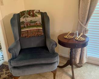 Velvet covered wing back chair, wood side table