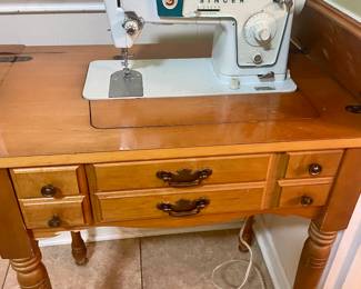 Singer sewing machine with wood cabinet