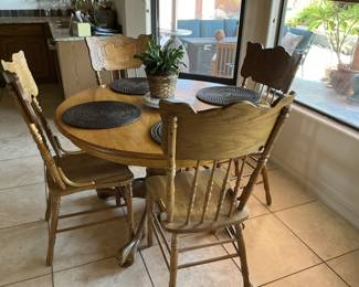 Wood table, four chairs and leaf. -$150