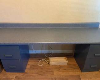 A Homemade Desk With Two File Cabinets