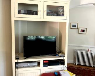 wooden console, holds television, storage on the top and bottom excellent condition. $100