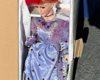 doll in purple dress