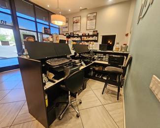 L shaped reception desk, dark brown with a glass top. 46H x 66D x 102W
Lots of drawers and cubbys