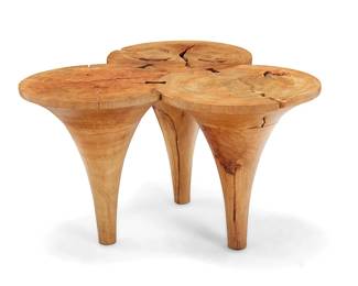 1009
Late 20th/early 21st century
A Modern burlwood coffee table
The table constructed from three tapered solid wood pieces joined by butterfly joints
19.25" H x 33" W x 31.5" D
Estimate: $400 - $600