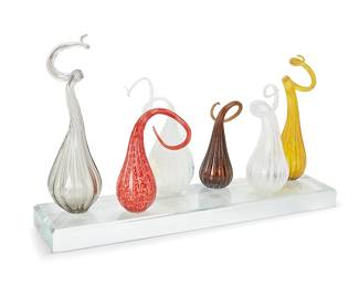 1207
Ginny Ruffner (1952-2025)
Six free-form art glass sculptures, early 21st century
Each unmarked, attributed by repute
Each mounted to an acrylic base
Overall: 21.25" H x 36" W x 10.5" D
Estimate: $400 - $600