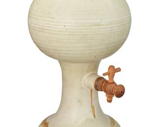1206
Late 20th/early 21st century
A Modern ceramic beverage dispenser
The glazed ceramic footed vessel with carved wood spigot and cork stopper
16.25" H x 10.25" W x 9.875" D
Estimate: $200 - $400