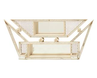 1295
Mid-20th century
A Modern atomic-style wall mirror
Stamped verso: Illinois Moulding Company / Chicago 8, Illinois / Made in U.S.A.
The enameled metal frame with metal mesh wire and star-form accents, featuring two opposed cubbies, the mirrored elements with antiqued effect
29.75" H x 66" W x 6.25" D
Estimate: $200 - $400