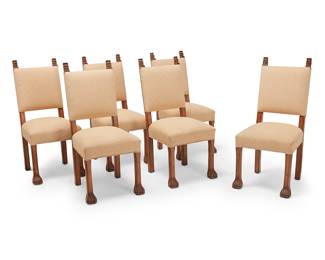 1116
Late 20th/early 21st century
A set of William Switzer walnut "Tahitian" side chairs
Each with metal tag to underside: Made in the U.S.A. / Charles Pollock Reproductions, Inc. / Los Angeles, CA
From the Charles Pollock Collection by William Switzer, each carved walnut dining chair with opposed masks to upper corners of seatback and front paw feet, upholstered in a diamond motif pattern fabric with brass tacking
6 pieces
Each: 42.75" H x 19.5" W x 24.5" D
Estimate: $800 - $1,200