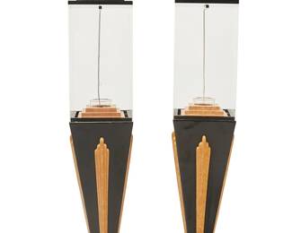 1052
1980s
A pair of Art Deco Revival display stands
The painted wood stands, each with tiered base and top, featuring a single light and acrylic case, electrified
2 pieces
Each: 63" H x 12" W x 12" D
Estimate: $400 - $600