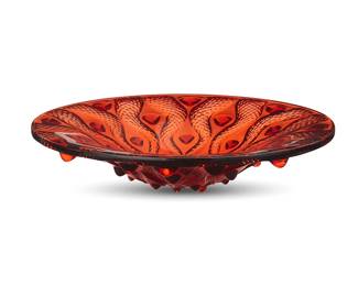 1173
Circa 2000s
A Lalique glass "Serpentine" centerpiece bowl
Etched to underside at rim: Lalique ® France [post-1978]; and numbered: G0122
After René Lalique's (1860-1945) "Bulbes" design
3.25" H x 15" Dia.
Estimate: $800 - $1,200
