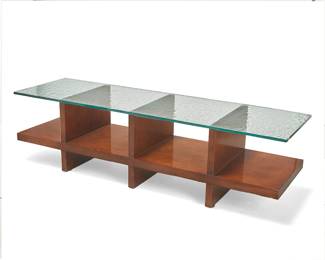 1345
Early 21st century
A Century Furniture wood and glass coffee table
The veneered wood base with three compartments, surmounted by a glass top
Overall: 18.5" H x 68" W x 20" D
Estimate: $300 - $500