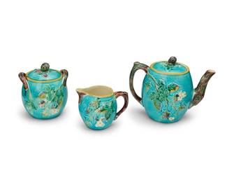 1040
Late 19th/early 20th century
A Continental majolica pottery tea service
Sugar marked to underside: FS; creamer marked: D
The glazed earthenware set, each with berry branches in relief on a robin's egg blue ground, with branch-form handles, comprising a teapot (5.5" H x 6.75" W x 4.375" D), a lidded sugar (4.5" H x 4.25" W x 4" D), and a creamer (3.125" H x 4.125" W x 3" D)
3 pieces
Estimate: $300 - $500