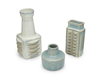 1318
Three Danish studio pottery vases
Mid/late 20th century
Three works:

Two Soeholm Keramik glazed ceramic vases
Each incised to underside: Soholm / Denmark / Stentoj; Each stamped with cipher and alternately: 3405 / 3407; Each with applied sticker: Soholm Stentoj / [ship logo] / Bornholm Denmark
Comprising two light-blue glazed vases, each with stepped protrusions to body
Larger: 11.25" H x 6" Dia.; Smaller: 8.5" H x 4.125" W x 3.25" D
2 pieces

A Palshus glazed stoneware vase
Incised to underside: Palshus / Denmark / APL-S / C1; further marked in ink: D/7E
The cylindrical light blue glazed vase with sgraffito details to body
5" H x 5.25" Dia.

3 pieces total
Estimate: $300 - $500