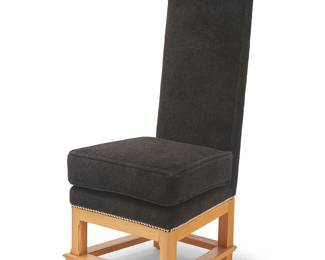 1048
In the manner of Jean Michel Frank (1895-1941)
A high-back side chair, late 20th century
Unmarked
The wood chair upholstered in black fabric with metal tacking, above squared legs joined by a box stretcher
46" H x 20.5" W x 23.5" D
Estimate: $500 - $700