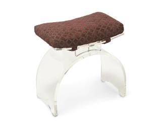 1356
Late 20th century
A Modern Lucite vanity stool
The acrylic stool with arched support and curved seat surmounted by a velvet-upholstered seat cushion
21" H x 20.5" W x 13" D
Estimate: $200 - $400
