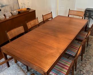 **update** the kipp stewart dining table has a leaf and can seat up to 8 (we also have all 8 caned chairs)