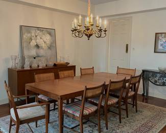 **update** the kipp stewart dining table has a leaf and can seat up to 8 (we also have all 8 caned chairs)